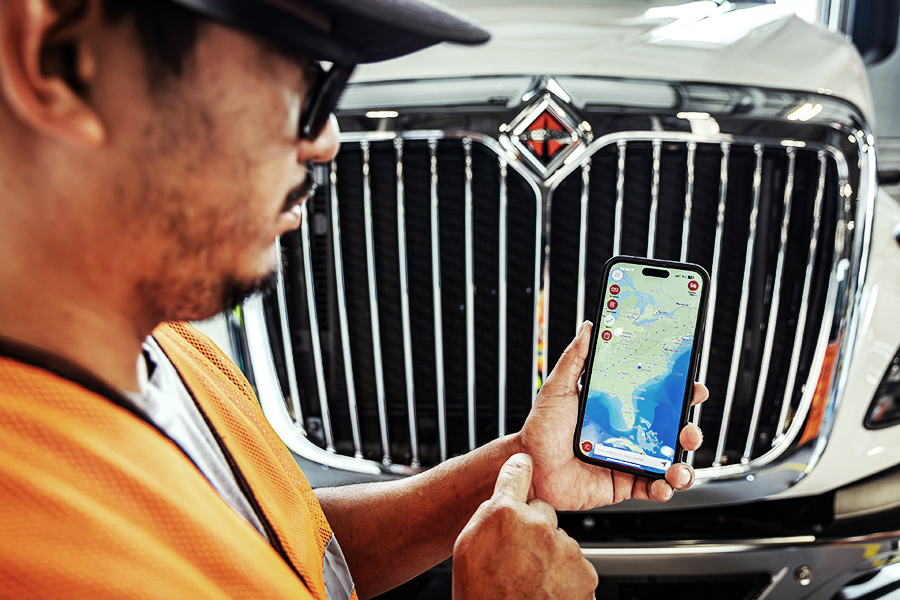 Employee holding a mobile device showing a map